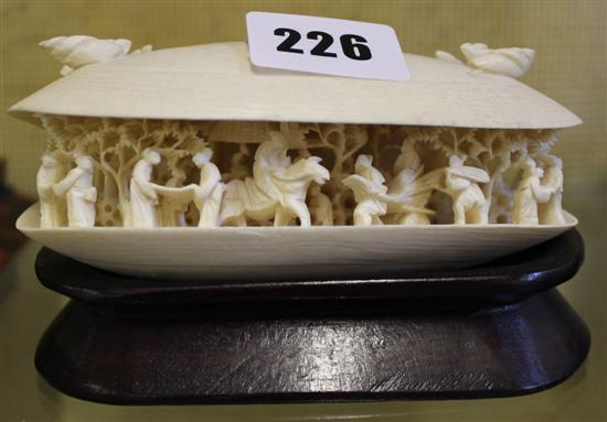 Early 20C Japanese ivory clam shell, carved with figures in gardens, hardwood stand
